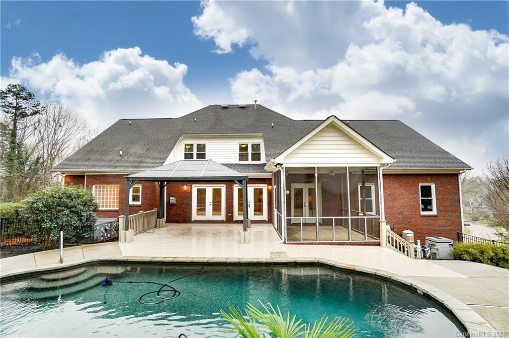 7064 Harbor Court Tega Cay, SC 29708 - Photo 42 of 48 a front view of a house with a yard