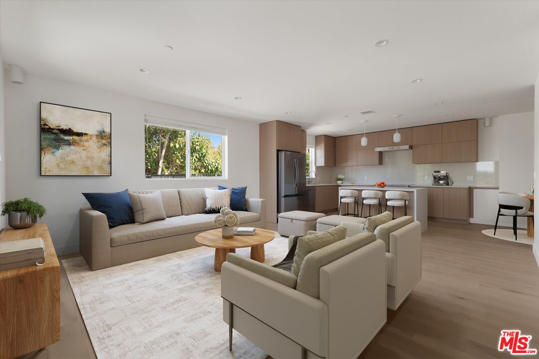15207 Morrison Street Sherman Oaks, CA 91403 - Photo 29 of 34 a living room with furniture and a large window