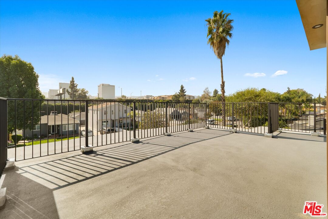 15207 Morrison Street Sherman Oaks, CA 91403 - Photo 32 of 34 a view of a terrace with a bench