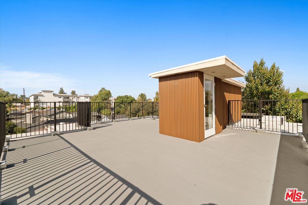 15207 Morrison Street Sherman Oaks, CA 91403 - Photo 33 of 34 a view of a house with a backyard