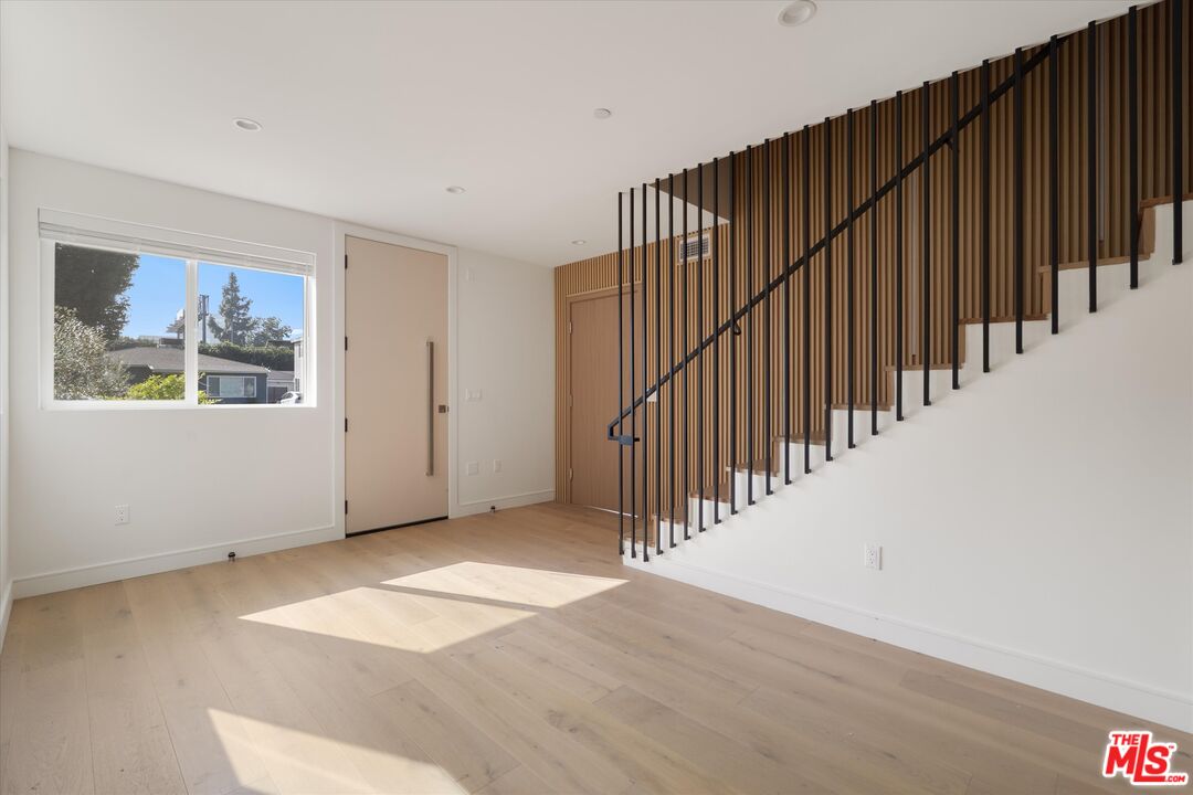 15207 Morrison Street Sherman Oaks, CA 91403 - Photo 7 of 34 a view of a hallway with wooden floor stairs