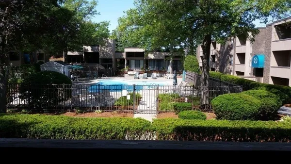 a view of swimming pool and outdoor seating