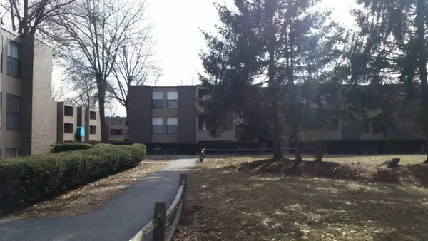 a view of a street with a building in the background