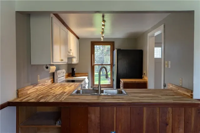 a kitchen with sink and window