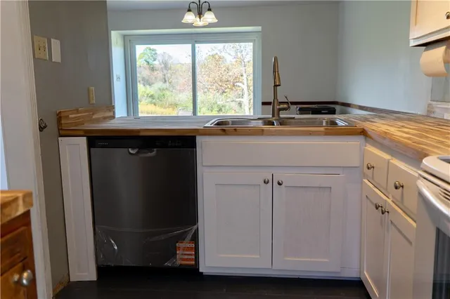 a kitchen with a sink and a window