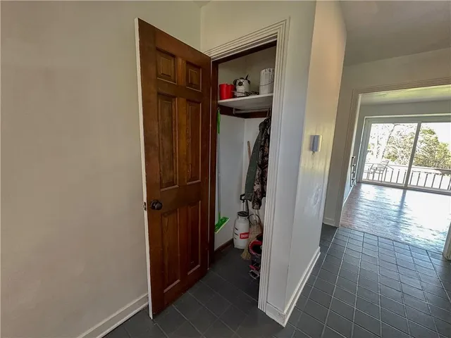 a hallway with washer and dryer