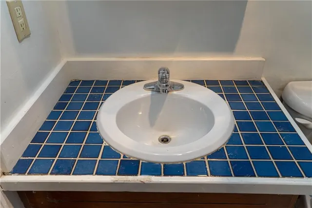 a bathroom with a sink and a mirror