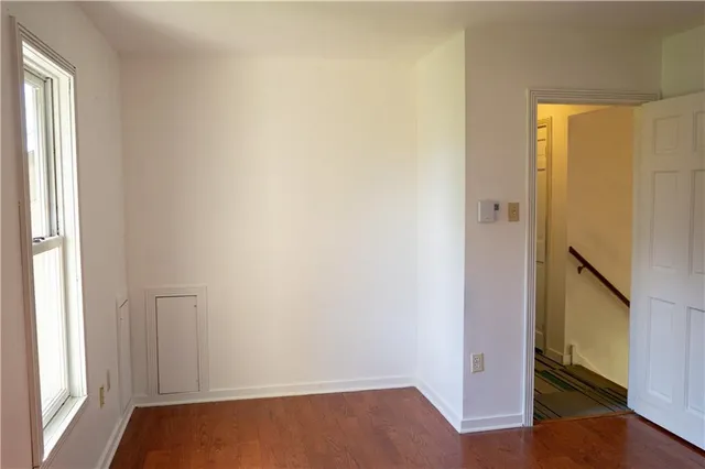 a view of front door with wooden floor
