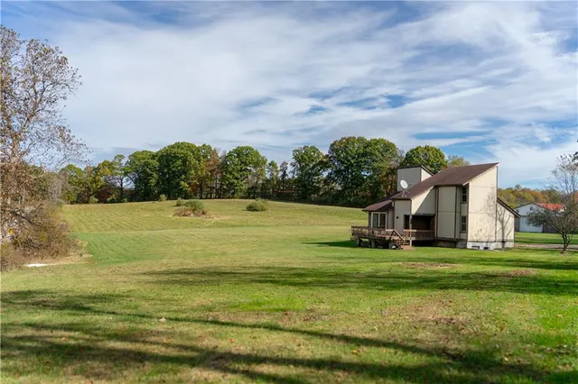 a view of a with large trees