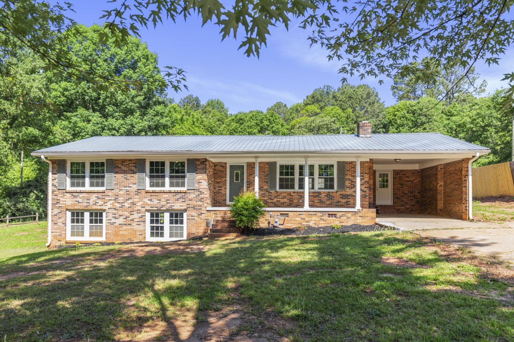 104 Doyle Drive Seneca, SC 29678 - Photo 1 of 19 This classic brick residence features a durable metal roof and a convenient carport, ideal for comfortable living.