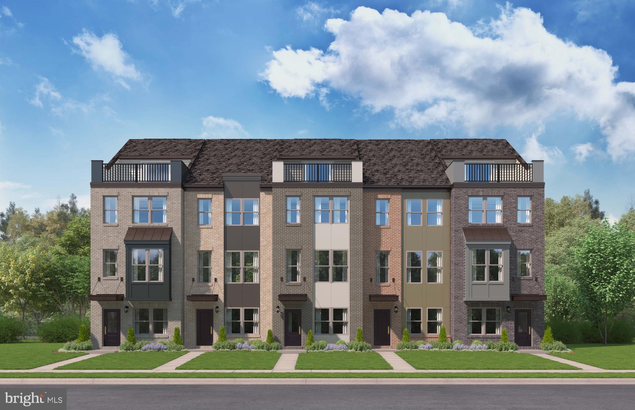 a front view of a residential apartment building with a yard