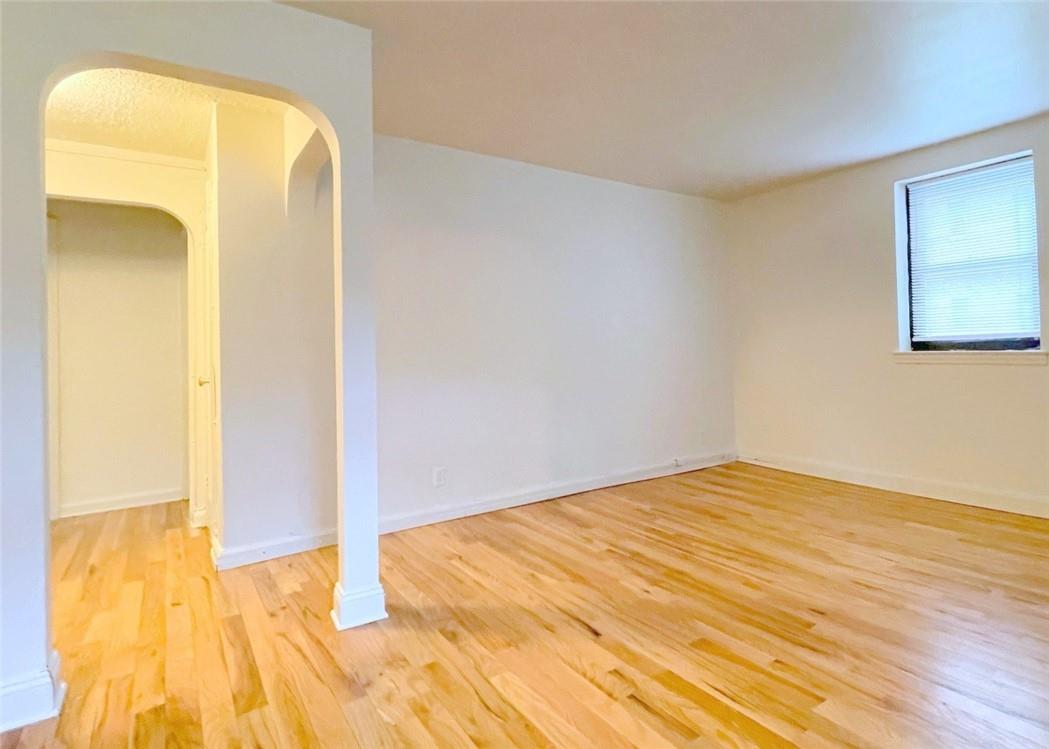 124 Richbell Road, Unit A4 Mamaroneck, NY 10543 - Photo 11 of 18 a view of a room with wooden floor and a bathroom