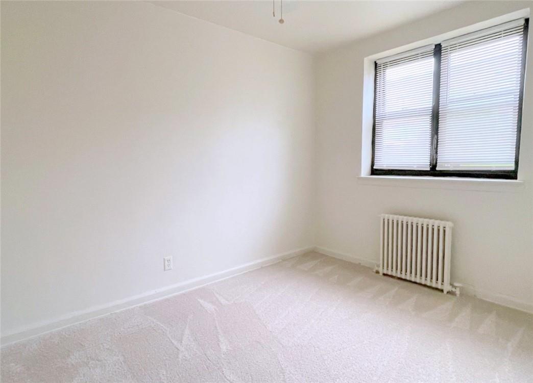 124 Richbell Road, Unit A4 Mamaroneck, NY 10543 - Photo 17 of 18 a view of an empty room with a window