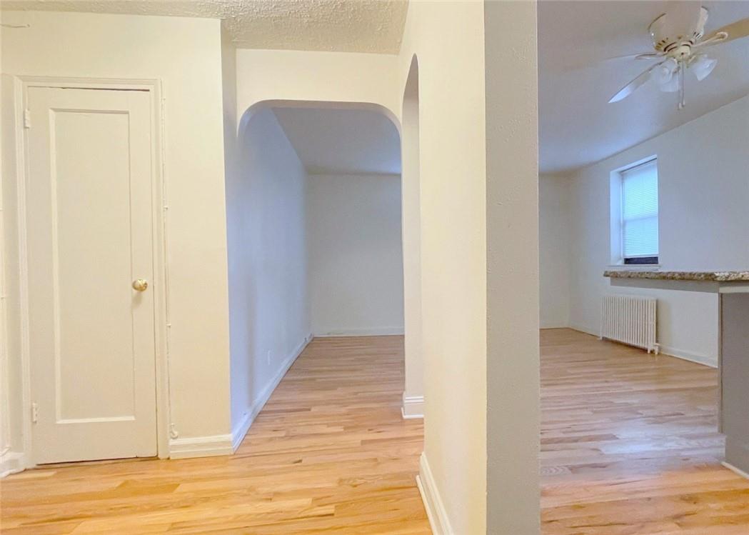 124 Richbell Road, Unit A4 Mamaroneck, NY 10543 - Photo 3 of 18 a view of a kitchen from the hallway