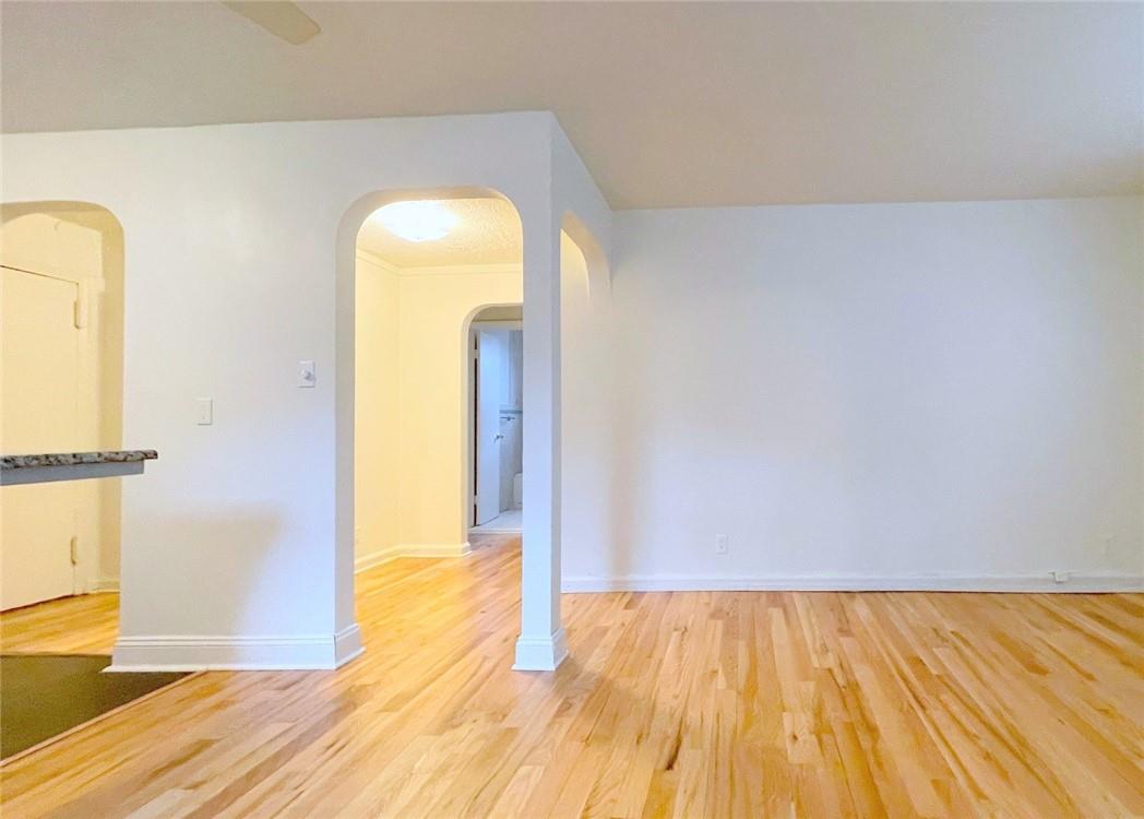 124 Richbell Road, Unit A4 Mamaroneck, NY 10543 - Photo 5 of 18 a view of empty room with wooden floor and wall