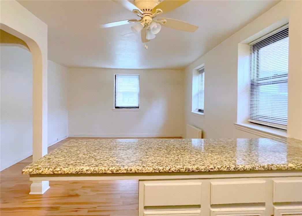 124 Richbell Road, Unit A4 Mamaroneck, NY 10543 - Photo 7 of 18 a view of a livingroom with wooden floor and a window