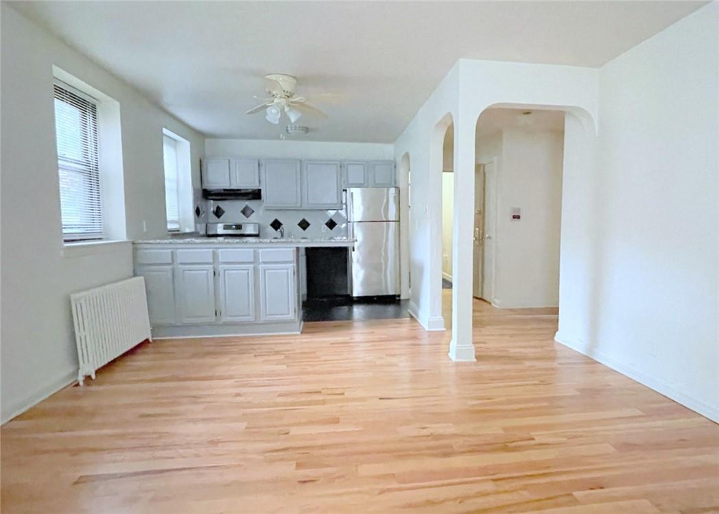 124 Richbell Road, Unit A4 Mamaroneck, NY 10543 - Photo 8 of 18 a kitchen with stainless steel appliances granite countertop a refrigerator and a stove top oven