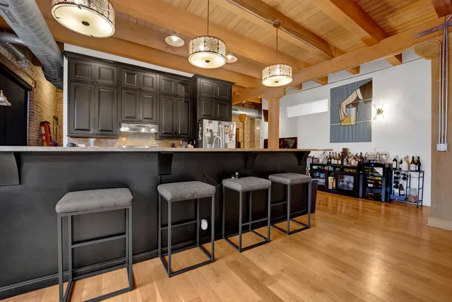 a kitchen with stainless steel appliances granite countertop a stove and a sink