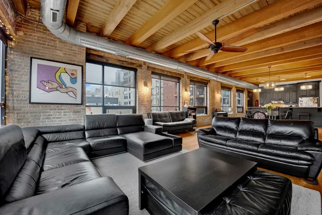 a view of a patio with dining table and chairs
