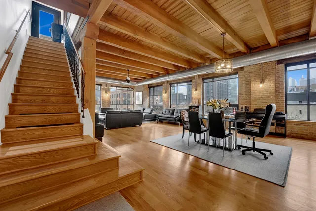 a bedroom with a bed next to a window