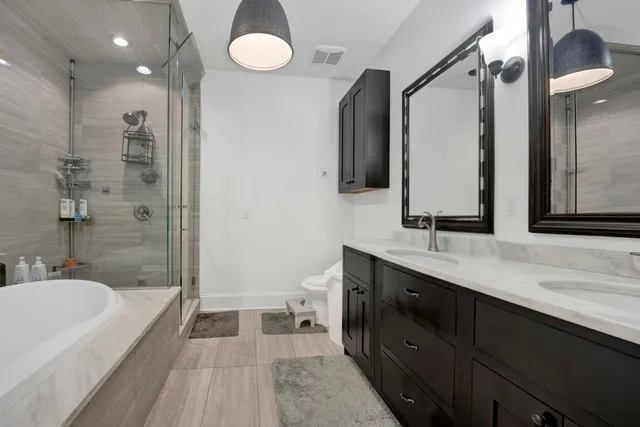 a bedroom with a bed chair and a desk