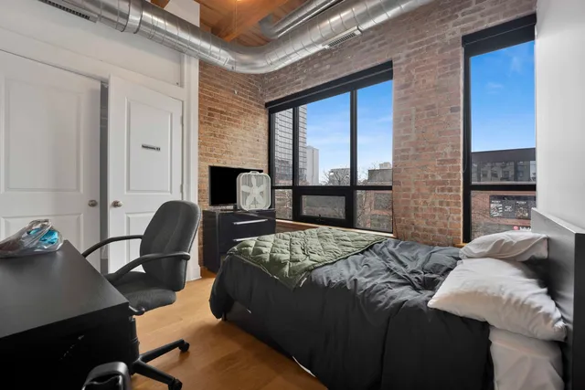 a bathroom with a double vanity sink toilet and mirror