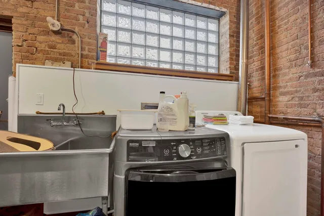 a stove top oven sitting inside of a kitchen