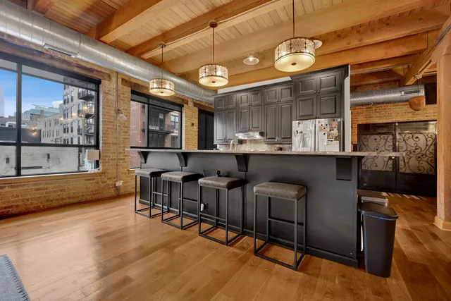 a large room with lots of chairs and a chandelier