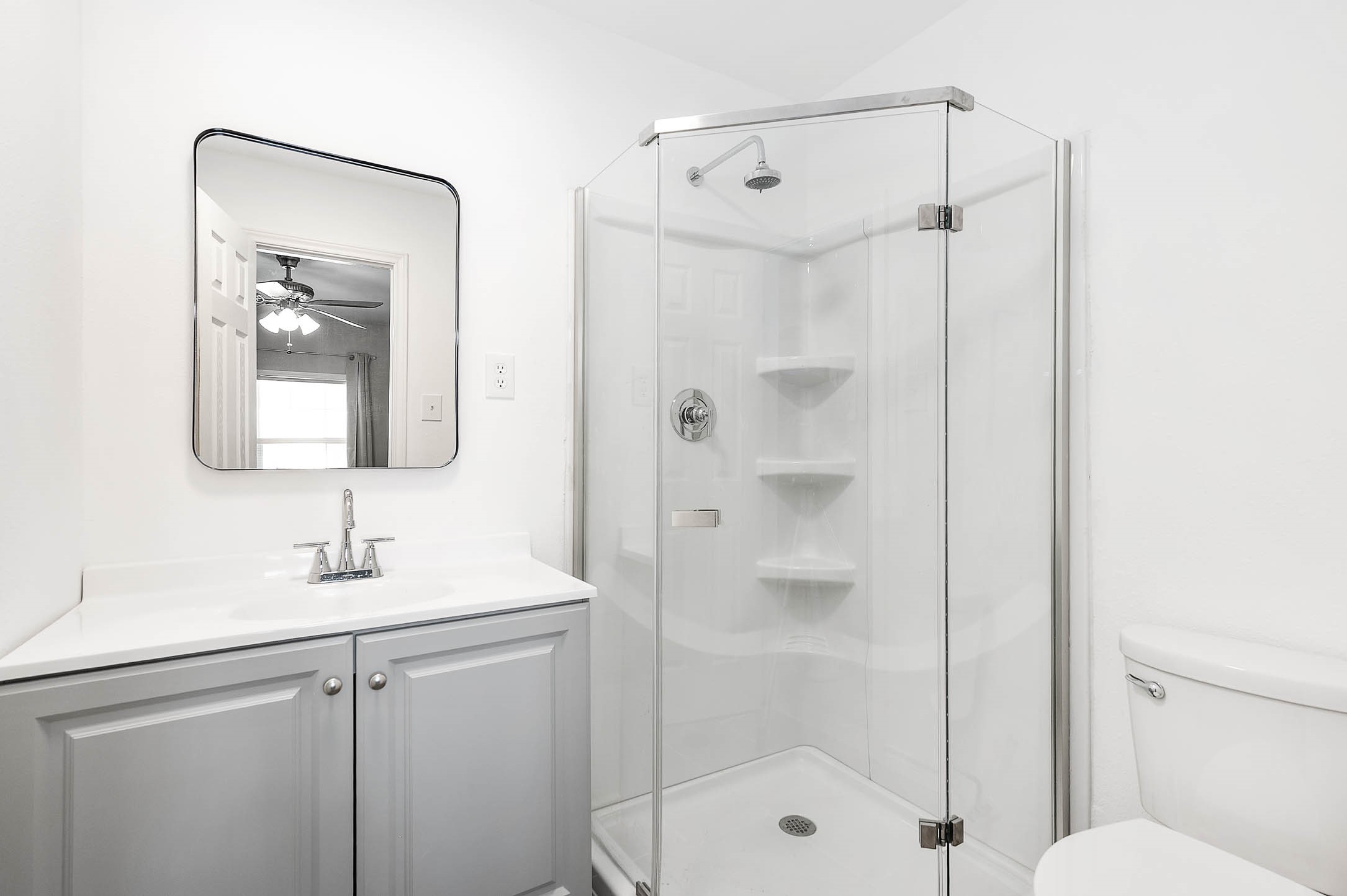 3910 Luca Street, Unit R1 Houston, TX 77021 - Photo 13 of 31 a bathroom with a shower sink vanity and mirror