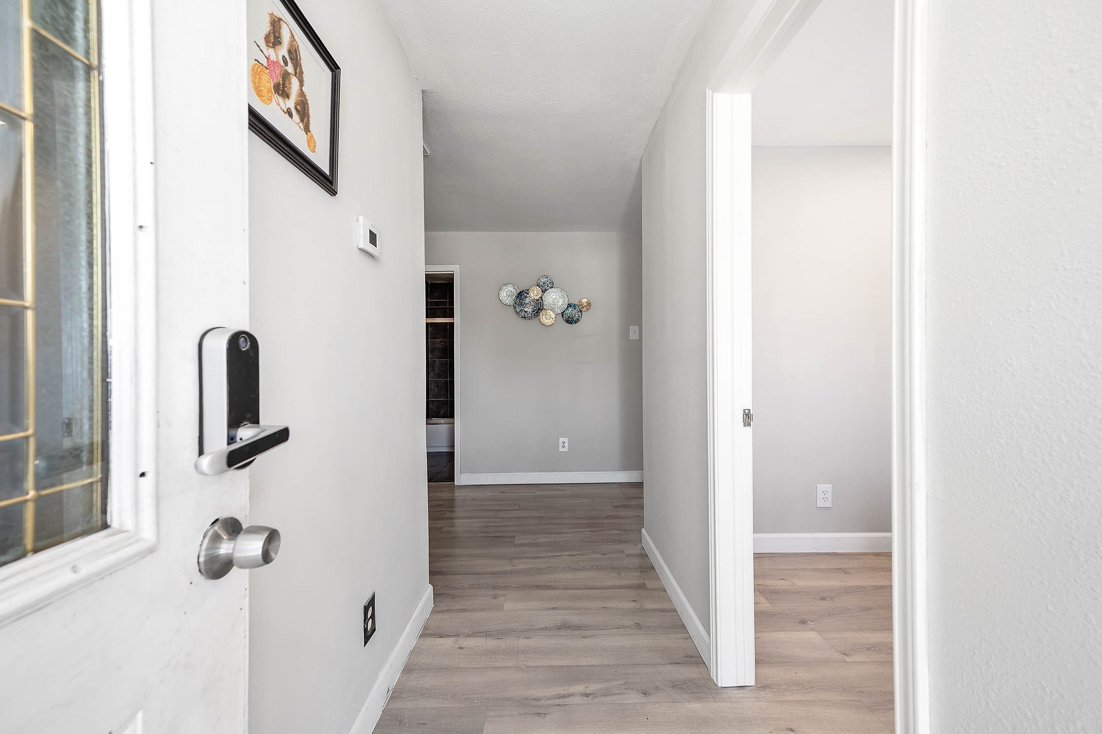 3910 Luca Street, Unit R1 Houston, TX 77021 - Photo 5 of 31 a view of a hallway with wooden floor and staircase