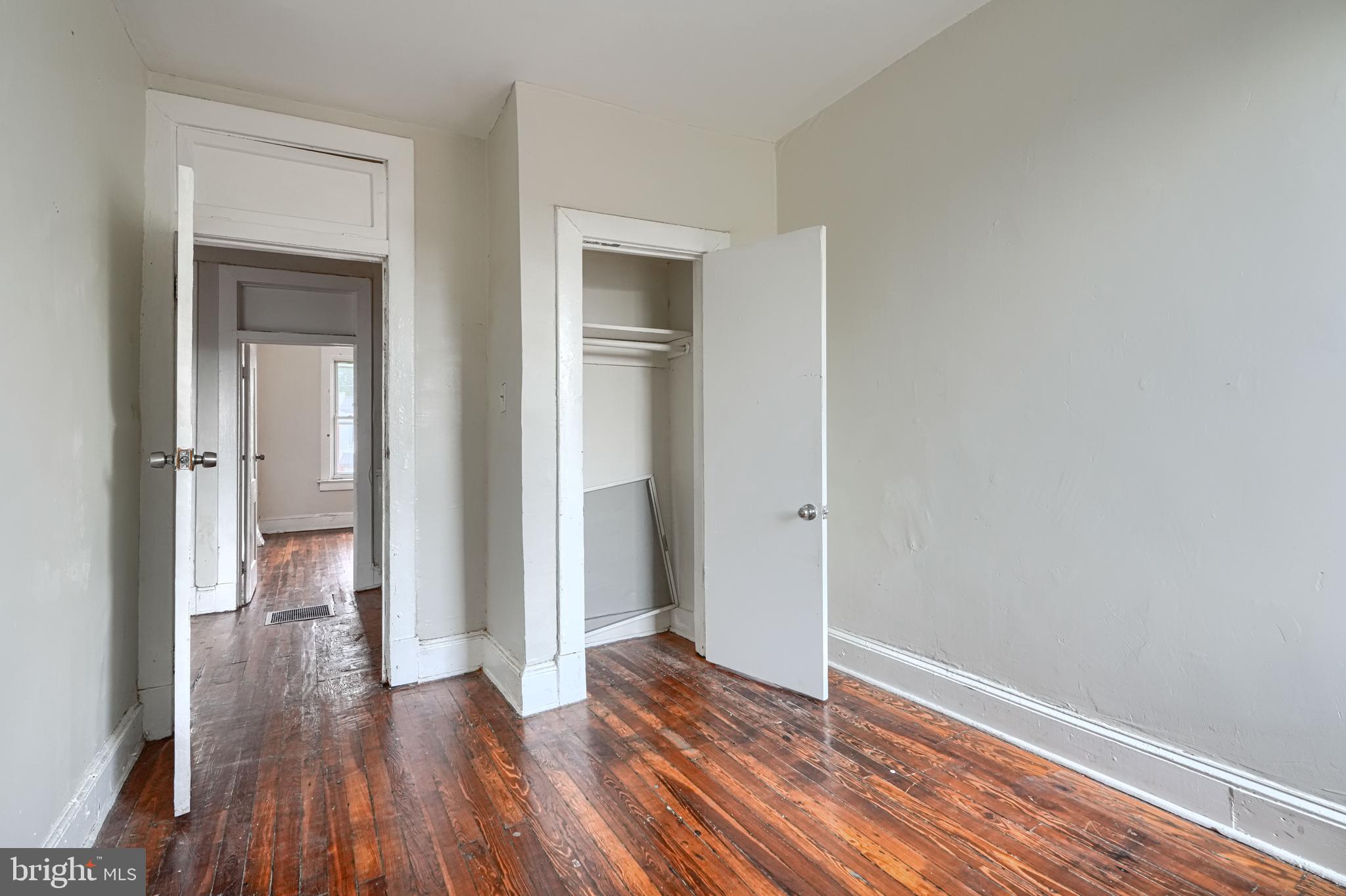 4806 Reisterstown Road Baltimore, MD 21215 - Photo 24 of 34 a view of hallway with bathroom and wooden floor