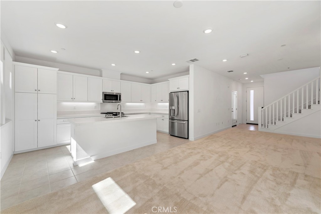 214 Denali Lake Forest, CA 92630 - Photo 3 of 11 a view of kitchen with wooden cabinet