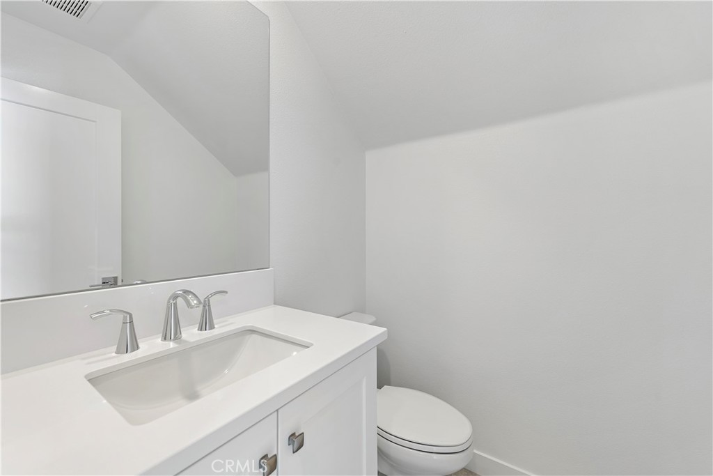 214 Denali Lake Forest, CA 92630 - Photo 6 of 11 a bathroom with a sink a toilet and vanity