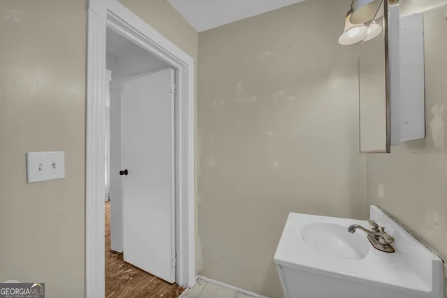 a bathroom with a sink and mirror