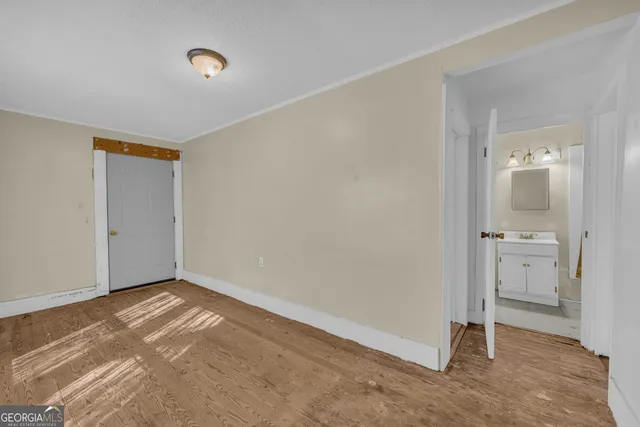 an empty room with a bathroom