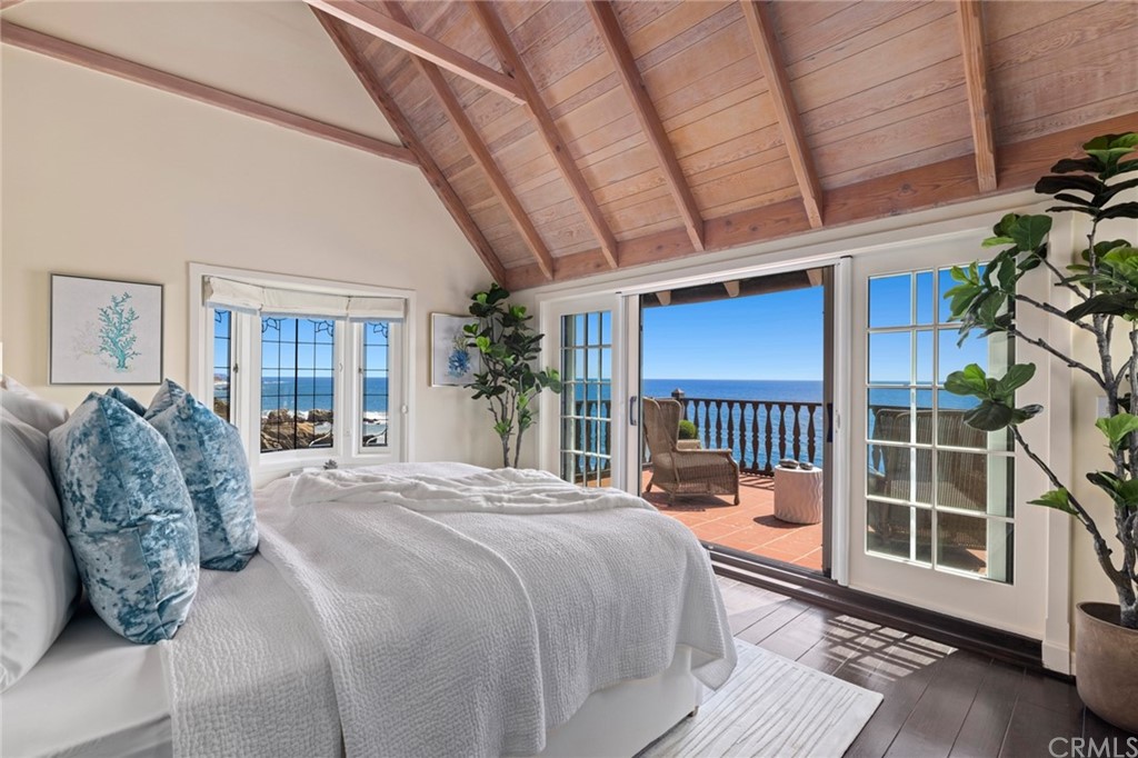 1991 Ocean Way Laguna Beach, CA 92651 - Photo 12 of 52 a bed sitting in a spacious bedroom next to a window