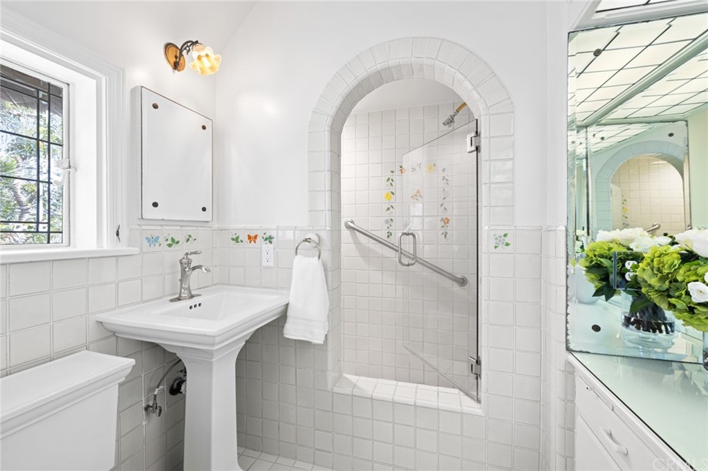 1991 Ocean Way Laguna Beach, CA 92651 - Photo 18 of 52 a bathroom with a sink a mirror and a shower