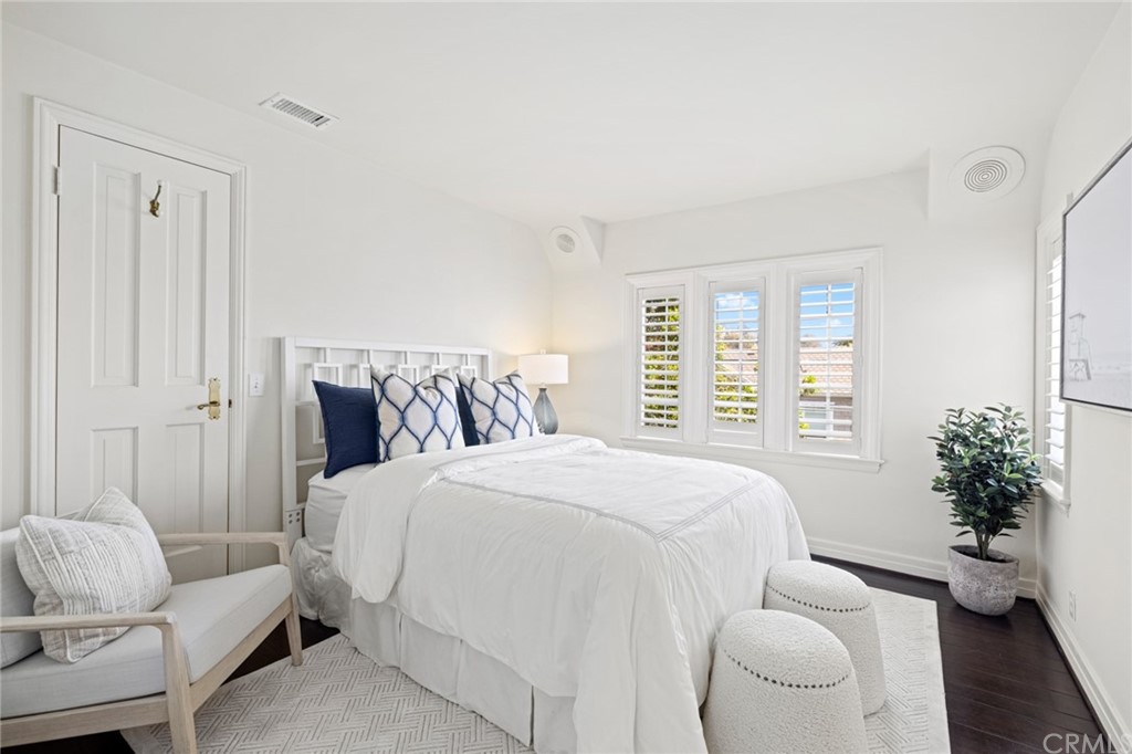 1991 Ocean Way Laguna Beach, CA 92651 - Photo 19 of 52 a bedroom with a bed and a potted plant