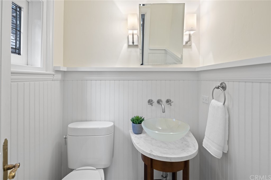 1991 Ocean Way Laguna Beach, CA 92651 - Photo 23 of 52 a bathroom with a sink a toilet and mirror