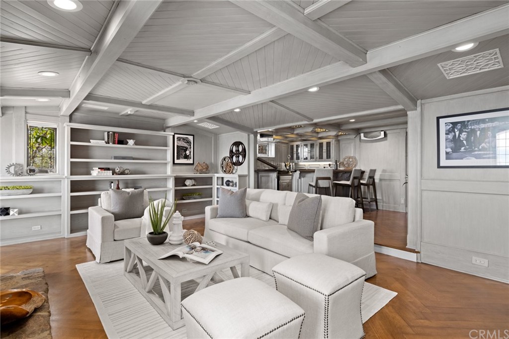 1991 Ocean Way Laguna Beach, CA 92651 - Photo 25 of 52 a living room with furniture kitchen view and a wooden floor