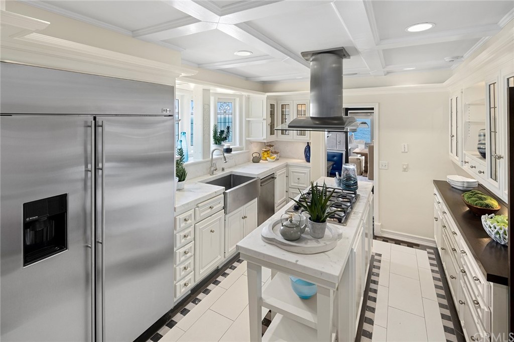 1991 Ocean Way Laguna Beach, CA 92651 - Photo 10 of 52 a kitchen with stainless steel appliances a refrigerator a sink a stove and white cabinets