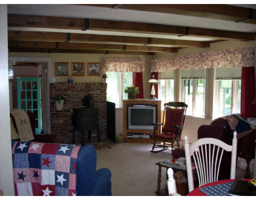 499 Ipswich Road Boxford, MA 01921 - Photo 5 of 21 a view of a livingroom with furniture and windows