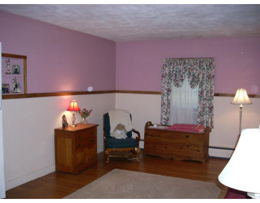 499 Ipswich Road Boxford, MA 01921 - Photo 9 of 21 a living room with furniture and a lamp
