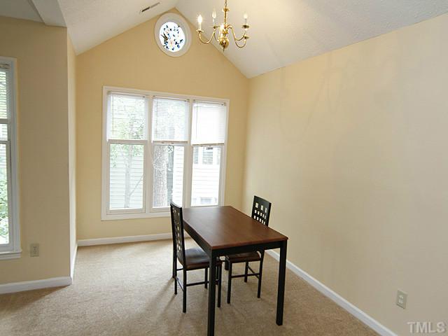 532 Springfork Drive Cary, NC 27513 - Photo 3 of 13 The dining room shows off the ceiling with the ornate circular window.