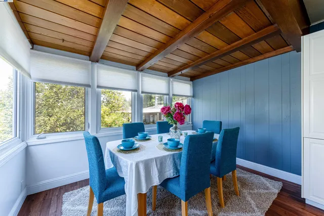 a dining room with furniture and window