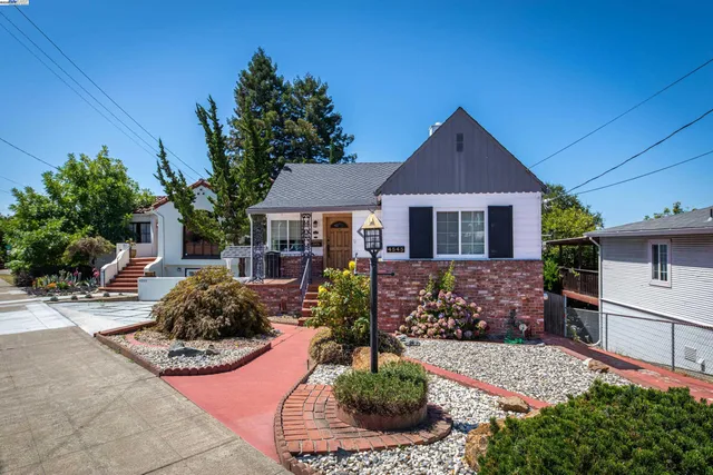a front view of a house with garden
