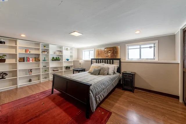 a bedroom with a bed and closet