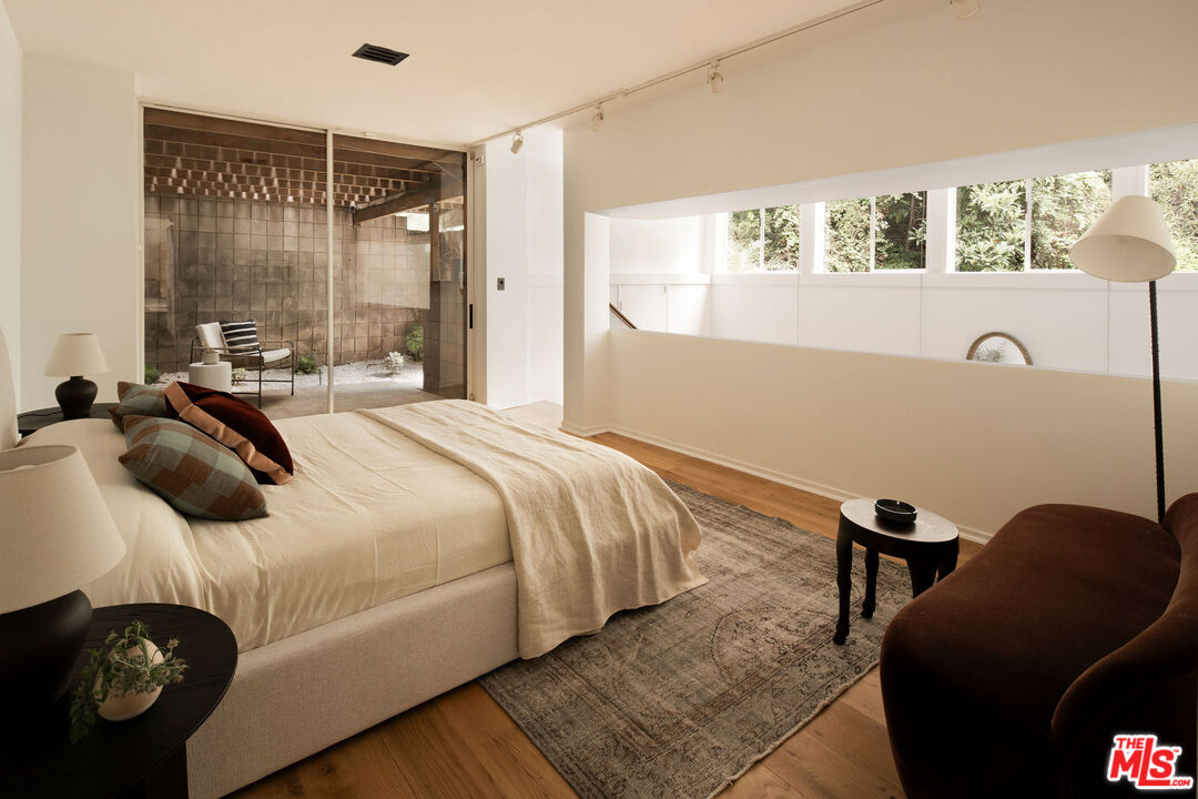7330 Pyramid Drive Los Angeles, CA 90068 - Photo 21 of 28 a bedroom with a bed and a window