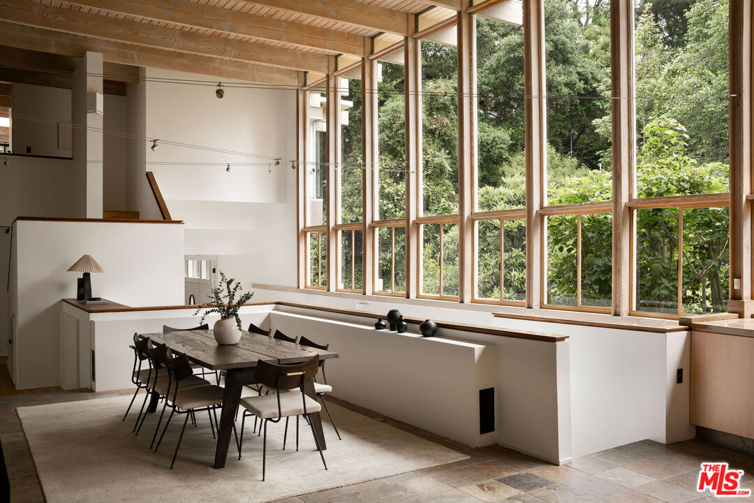 7330 Pyramid Drive Los Angeles, CA 90068 - Photo 3 of 28 a dining room with a large window and table