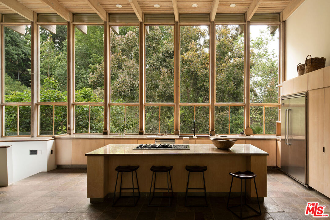 7330 Pyramid Drive Los Angeles, CA 90068 - Photo 4 of 28 a room with a large window and dining table